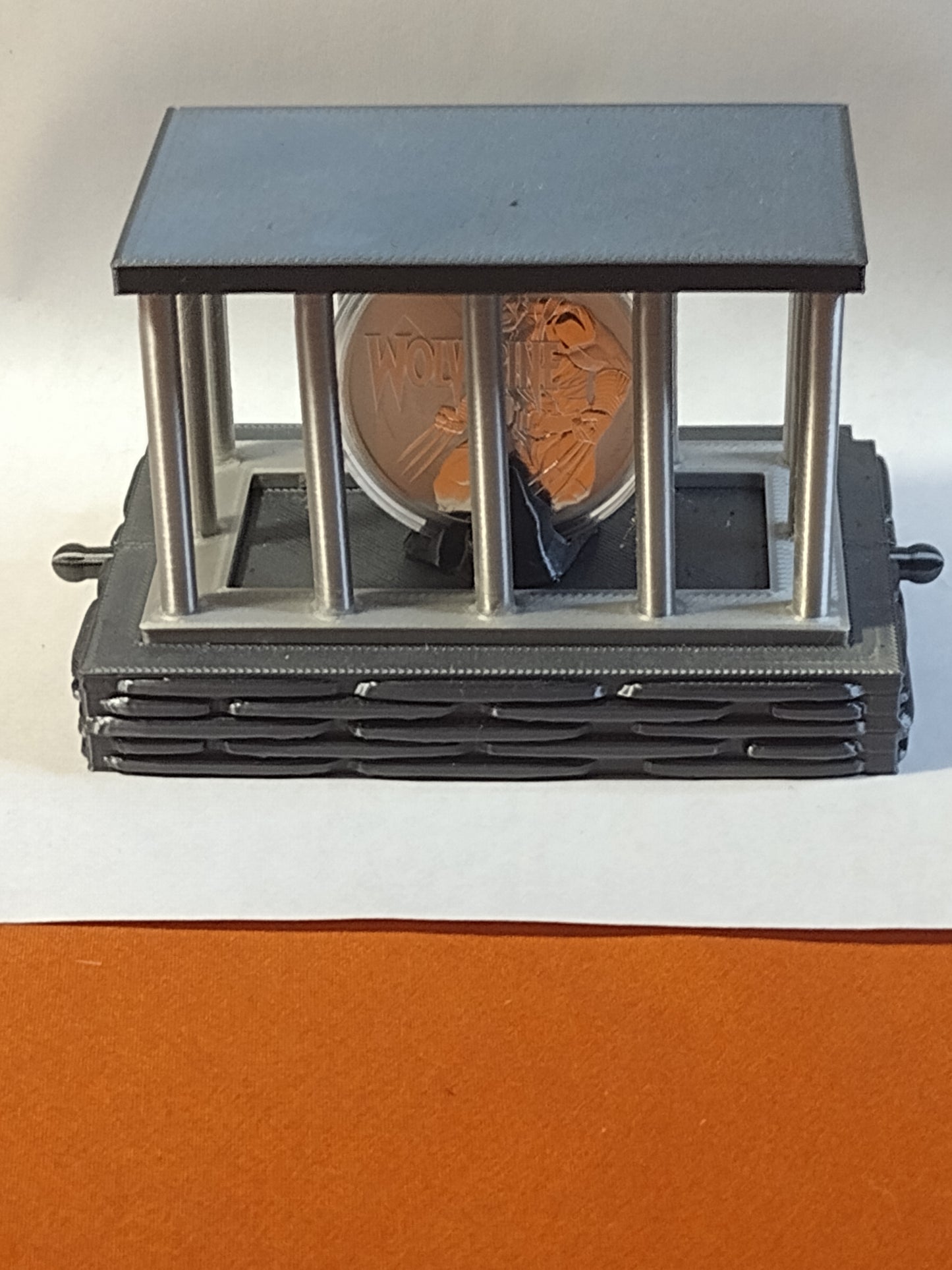 cage coin capsule display