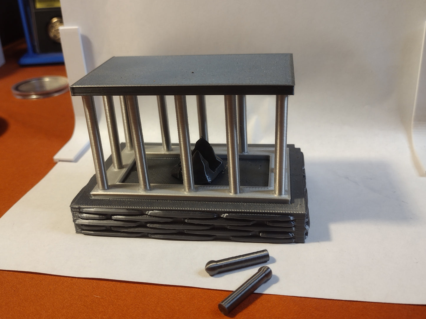 cage coin capsule display